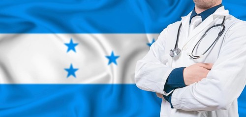 Honduras healthcare concept. Male doctor on Honduras flag. Doctor with crossed arms on Honduras
