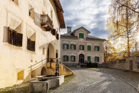 Engadin houses, historic houses, Dorstrasse with houses, birch, autumn, Guarda, Engadin, Grisons,
