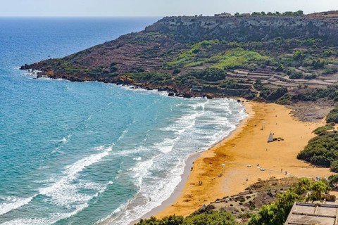 View from elevated position of beach in Ramla Bay, Gozo, Malta