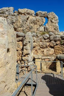 View from secured walkway with railing through ruins remains of Ggantija temple, UNESCO World