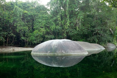 Turquoise blue water between rocks in the tropical rainforest of Babinda Boulders Queensland,
