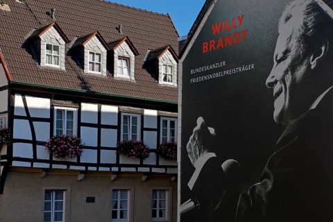 Huge poster with Willy Brandt portrait on a fire wall of the Willy Brandt Forum next to a
