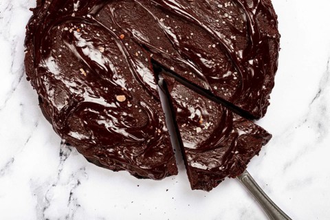Chocolate cake, round cake, on a marble light table, top view, homemade cakes, no people