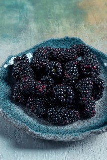 Fresh blackberry berry, on a plate, top view, no people