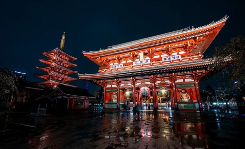 Illuminated five-story pagoda and main hall of Asakusa Shrine or Senso-ji Temple, at night,