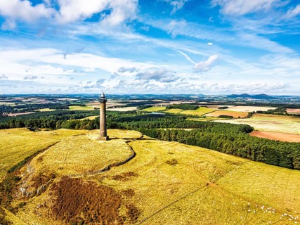 Waterloo Monument over Scottish fields and farms from a drone, Jedburgh, Scotland, UK
