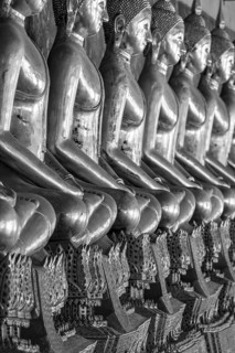 Gilded Buddha statues (Bhumispara mudra: Buddha Gautama at the moment of enlightenment), Wat Suthat