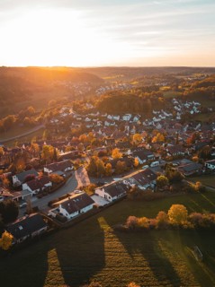 Aerial view of a village in autumn with warm sunset light, Deufringen, Aidlingen, Böblingen