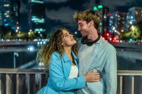 Young couple embracing and looking into each other's eyes, expressing love and togetherness on a