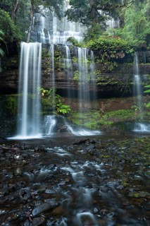 Russell Falls. Australia's most beautiful waterfall in the green Tasmanian forest, between ferns