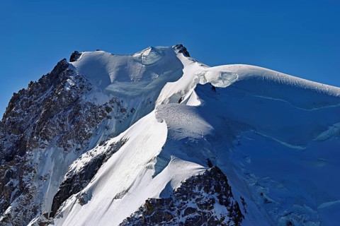 View of the snow-covered Mont Blanc du Tacul from the Aiguille du Midi, Chamonix-Mont-Blanc,