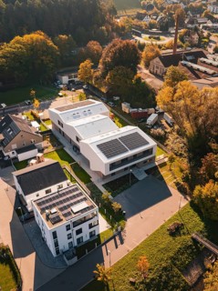 Aerial view of a modern settlement with solar panels in autumn light, Nagold, Black Forest, Germany