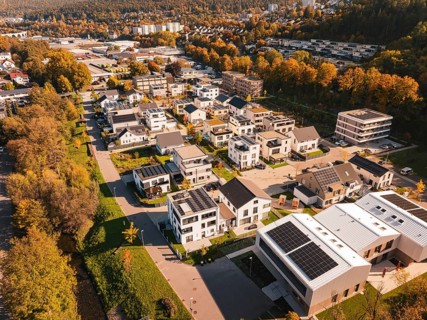 Modern residential buildings with solar panels in autumn surroundings, Nagold, Black Forest,