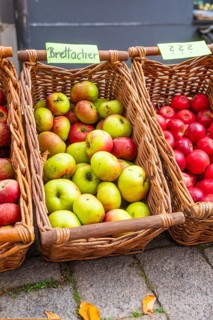 Baskets with various types of apples on display at a market, Streuobstmarkt, Sindelfingen,
