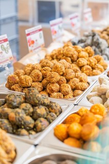 Colourful vegetarian foods displayed in rows at a market stand, Streuobstmarkt, Sindelfingen,