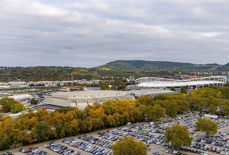 Neckarpark Stuttgart with Hanns-Martin-Schleyer-Hall and MHP Arena. Cars parked on the Wasen