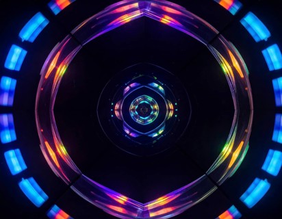 Abstract background of slightly unfocused multicolored glass lenses spinning and rotating,