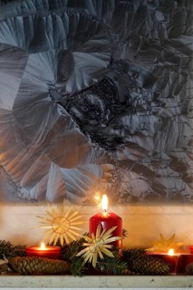 Christmassy decorated iced window, candle light, straw stars, Germany