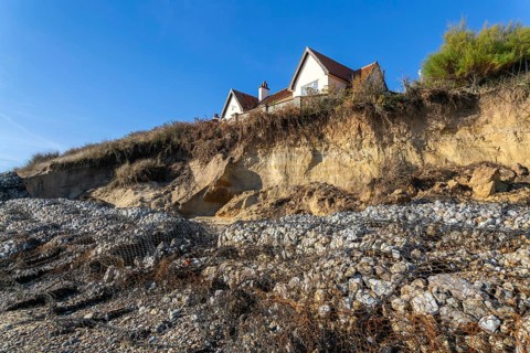 Clifftop houses at risk from coastal erosion, Thorpeness, Suffolk, North Sea coast, England, UK