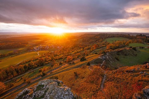 Low sun shines in the Spielburg Nature Reserve, Hohenstaufen, Göppingen, Baden-Württemberg, Germany
