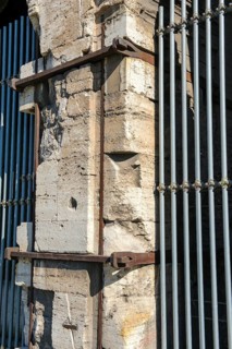 Pillar element made of travertine stone from Colosseum with architectural measure used in the
