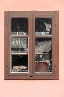Pink house facade, window with old objects, Kranj, Upper Carniola, Slovenia