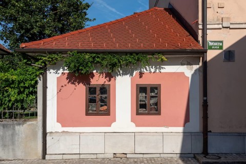 Pink house facade, window with old objects, Kranj, Upper Carniola, Slovenia