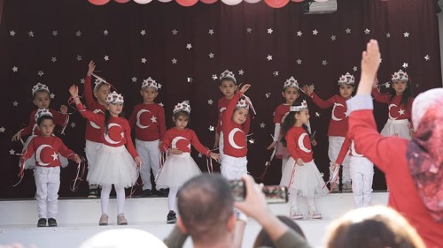Children celebrate the 102nd anniversary of the Republic Day of Turkey, a national holiday