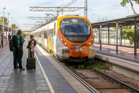 Renfe Civia commuter train at platform of Airport railway station, Rodalia de Barcelona suburban