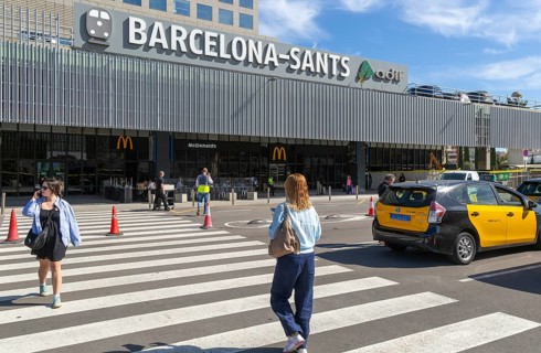 Taxis in street outside Barcelona-Sants railway station building in city centre, Barcelona,