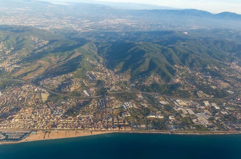 Oblique aerial view of settlements on coastal plain and hillsides, Mediterranean Sea coast, El