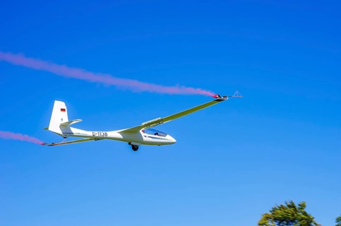 An SZD-59-1 ACRO glider, registration D-1138, during a demonstration as part of an air show at the