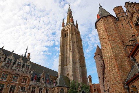 Gruuthusemuseum and mighty tower of the Church of Our Lady, Onze-Lieve-Vrouwekerk, in the historic
