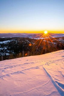 Sunrise over the hills of czech republic from Mount Lusen wth the view over the hills of the