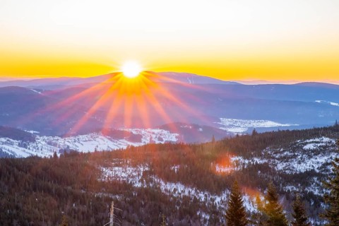 Sunrise over the hills of czech republic from Mount Lusen wth the view over the hills of the