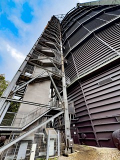 View steeply upwards on the outside with left external staircase of former Gasometer Oberhausen