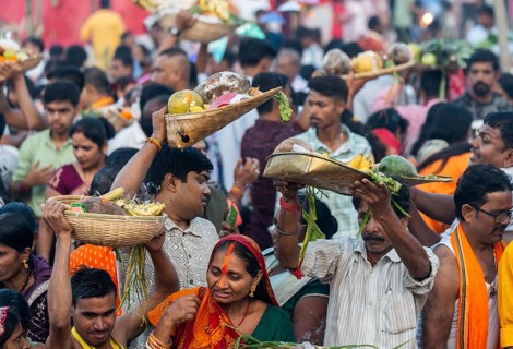 Hindu devotees gather on the banks of the Brahmaputra River to offer prayers to the Sun God on the
