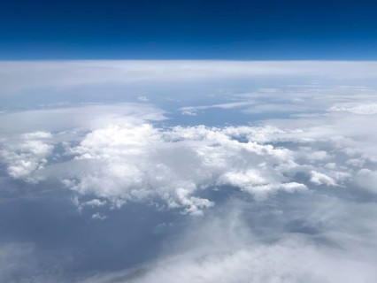 View from airplane of white bright cluster clouds Cirrus cirrus clouds, international
