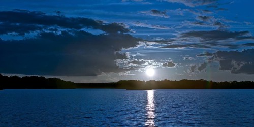 Atmospheric moonrise over Lake Gudelack, Lindow (Mark), Stechlin-Ruppiner Land nature park Park,