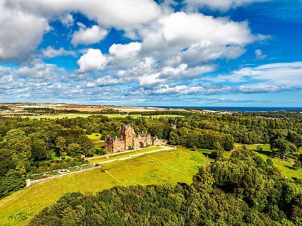 Ayton Castle from a drone, Ayton, Eyemouth, Scottish Borders, Scotland, UK