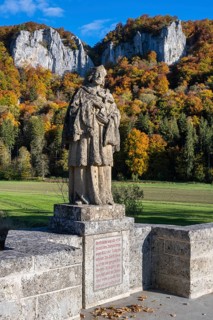 Statue, saint statue of Saint Nepomuk, patron saint of bridges, bridge saint on the historic arched