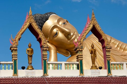 Head of reclining Buddha resting head on hand forearm on elbow, landmark of Wat Sri Sunthon