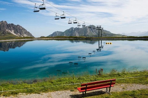 Mountain landscape with reservoir and chairlift, Saloberkopf, Warth, Bregenzerwald, Vorarlberg,