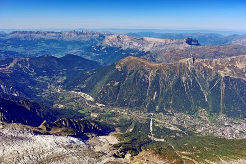 View from the Aiguille du Midi mountain station observation deck into the valley with the city,