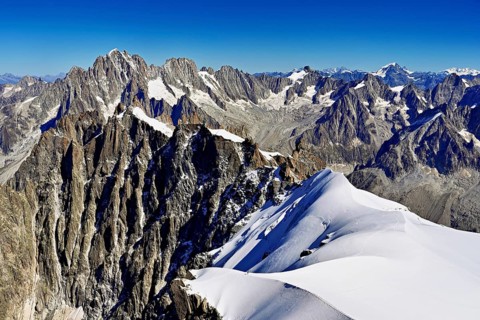 View from the Aiguille du Midi mountain station observation deck of the mountains Aiguille Vert,