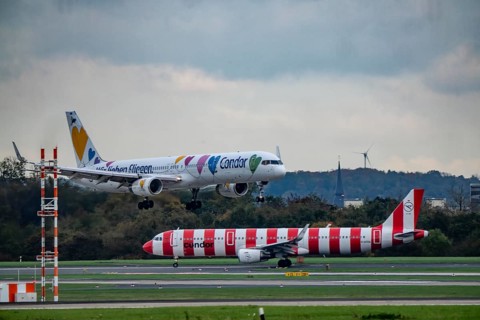 Condor aircraft landing and waiting for takeoff at Düsseldorf Airport, North Rhine-Westphalia,