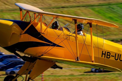 A biplane Bücker Bü 131 Jungmann with the registration HB-UUD during a flight demonstration as part