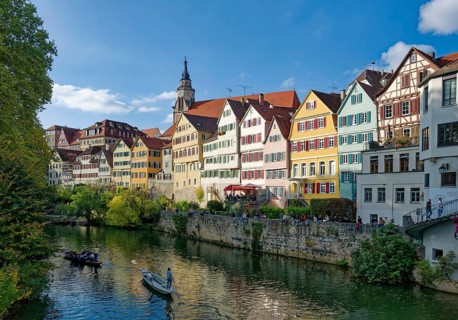 Historic houses on the Neckar front, the Neckar river with poking and water reflection, old town of