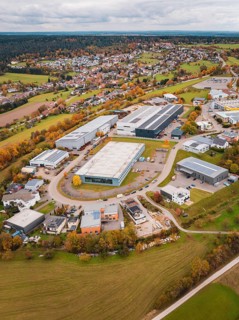 Industrial landscape with autumnal fields and buildings seen from a bird's eye view, Dornstetten,