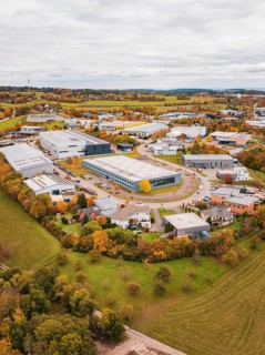 Large industrial area in autumn surroundings, bird's-eye view of houses and fields, Dornstetten,